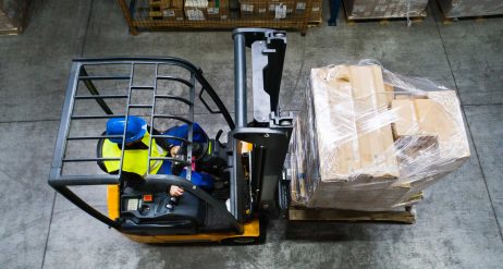 warehouse-man-worker-with-forklift-PR3WQUR.jpg